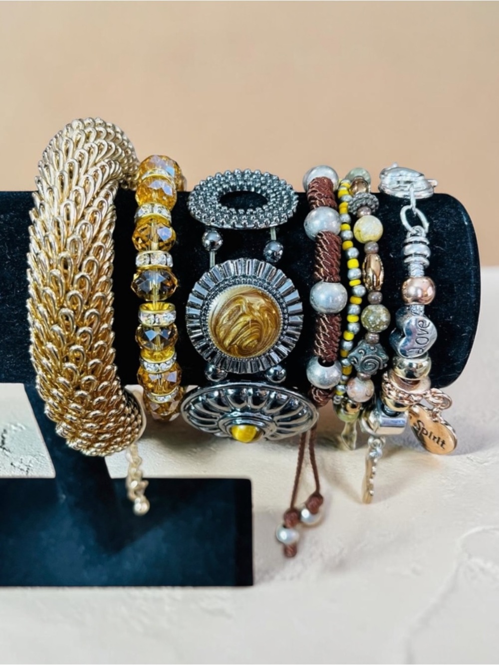 Elegant Gold and Brown Assortment of Bracelets